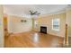 Open living area with fireplace, a ceiling fan, and plenty of natural light at 170 Glenn Allen Rd, Mooresville, NC 28115