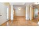 An empty Living Room displays recessed columns, beautiful wood floors, and an elegant chandelier at 170 Glenn Allen Rd, Mooresville, NC 28115