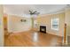 Bright living room with bamboo floors, fireplace, and two windows at 170 Glenn Allen Rd, Mooresville, NC 28115