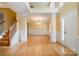 An empty Living Room displays recessed columns, beautiful wood floors, and an elegant chandelier at 170 Glenn Allen Rd, Mooresville, NC 28115