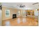 Open-concept living room with fireplace and view of the kitchen at 170 Glenn Allen Rd, Mooresville, NC 28115