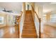 A staircase with wooden steps and white railings leads to the upper floor at 170 Glenn Allen Rd, Mooresville, NC 28115