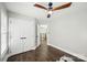 This bedroom features hardwood floors, ceiling fan and double door closet at 17101 Windy Oaks Ct, Cornelius, NC 28031