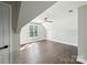 Bright bedroom features hardwood floors, a ceiling fan and plenty of natural light at 17101 Windy Oaks Ct, Cornelius, NC 28031