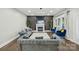 Cozy living room with a fireplace, dark accent wall, and comfortable seating at 17101 Windy Oaks Ct, Cornelius, NC 28031