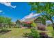 Beautiful backyard with a patio, green lawn, and mature trees at 1905 Tranquility Blvd, Lancaster, SC 29720