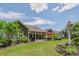 Manicured backyard featuring a patio, green grass, and landscaping at 1905 Tranquility Blvd, Lancaster, SC 29720