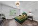 Well lit bedroom with green accents, bedside lamps, and decorative wood floors at 1905 Tranquility Blvd, Lancaster, SC 29720