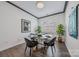 Cozy dining nook features modern light fixture, elegant decor and hardwood floors at 1905 Tranquility Blvd, Lancaster, SC 29720