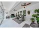 Sunroom with a ceiling fan, large windows, indoor plants, and comfortable seating at 1905 Tranquility Blvd, Lancaster, SC 29720