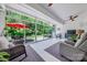 Bright sunroom featuring large sliding glass doors, comfortable seating, and a TV at 1905 Tranquility Blvd, Lancaster, SC 29720