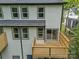 Elevated back view with wooden decks, sliding doors and lots of windows at 1933 St Mark St, Charlotte, NC 28216