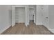 Bedroom with closet, doors, and modern flooring at 1933 St Mark St, Charlotte, NC 28216