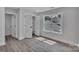 Bedroom with window, modern flooring, and storage closet at 1933 St Mark St, Charlotte, NC 28216