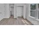 Bedroom featuring lots of natural light, modern flooring, and white walls at 1933 St Mark St, Charlotte, NC 28216
