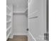 Walk in closet with modern shelving and floors at 1933 St Mark St, Charlotte, NC 28216