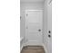 Entryway featuring modern doors, trim and baseboards, with light colored walls and wood-look flooring at 1933 St Mark St, Charlotte, NC 28216