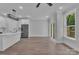Open living space with kitchen, recessed lighting, and a sliding glass door with backyard views at 1933 St Mark St, Charlotte, NC 28216