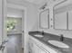 Bathroom featuring double sink vanity, modern lighting, and sleek fixtures at 1935 St Mark St, Charlotte, NC 28216