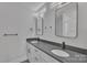 Modern bathroom with a double sink vanity, gray countertop, and stylish fixtures at 1935 St Mark St, Charlotte, NC 28216
