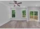 Bright bedroom featuring large windows and a sliding glass door that opens to a private deck at 1935 St Mark St, Charlotte, NC 28216
