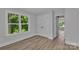 A bright and airy bedroom featuring a window and a large closet at 1935 St Mark St, Charlotte, NC 28216