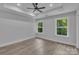 Bright bedroom featuring modern lighting, hardwood floors and large windows with a view at 1935 St Mark St, Charlotte, NC 28216