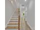 Inviting hallway showcasing wood stairs and flooring, leading to a bright, open living area at 1935 St Mark St, Charlotte, NC 28216