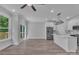 Open-concept living area with a modern kitchen and large windows, offering abundant natural light at 1935 St Mark St, Charlotte, NC 28216