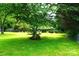 Backyard with a mature tree and a lush green lawn at 1958 19Th Avenue Ne Dr # 8, Hickory, NC 28601