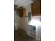 Finished basement features upper cabinets and a white storage shelf at 1958 19Th Avenue Ne Dr # 8, Hickory, NC 28601