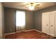 This bedroom features wood-look floors, neutral walls, and a double-door closet at 1958 19Th Avenue Ne Dr # 8, Hickory, NC 28601