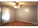 This bedroom features wood-look floors, neutral walls, and a classic ceiling fan at 1958 19Th Avenue Ne Dr # 8, Hickory, NC 28601