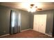 This bedroom features neutral carpet, neutral walls, and a double-door closet at 1958 19Th Avenue Ne Dr # 8, Hickory, NC 28601