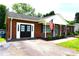 Inviting brick home with a double door entrance, patriotic flag, and well-kept landscaping at 1958 19Th Avenue Ne Dr # 8, Hickory, NC 28601