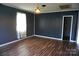 Bright living room features wood-look floors, neutral walls, and exterior access at 1958 19Th Avenue Ne Dr # 8, Hickory, NC 28601