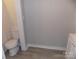 This bathroom features a toilet and sleek gray flooring at 209 Barber Rd, Gastonia, NC 28056