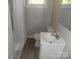 Bathroom features a toilet, vanity, and shower with curtain at 209 Barber Rd, Gastonia, NC 28056