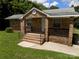 Charming brick home featuring a welcoming front porch and well-maintained landscaping at 209 Barber Rd, Gastonia, NC 28056