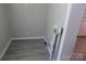 Unfinished laundry room with vinyl flooring and plumbing fixtures installed, ready for your washer and dryer at 209 Barber Rd, Gastonia, NC 28056