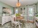 Cozy dining room with decorative rug, white furniture, accent lighting and calming wall color at 214 Wilcrest Dr, Matthews, NC 28105