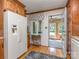 Bright eat-in kitchen with white appliances, wood cabinets, and a view to the sunroom at 214 Wilcrest Dr, Matthews, NC 28105