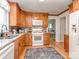 Updated kitchen featuring stone countertops, wooden cabinets, and stainless steel appliances at 214 Wilcrest Dr, Matthews, NC 28105