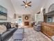 Comfortable living room features high ceiling, stone fireplace, hardwood floors, and stylish decor at 214 Wilcrest Dr, Matthews, NC 28105