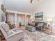 Bright and airy living room boasts hardwood floors, ample seating, and a calming atmosphere at 214 Wilcrest Dr, Matthews, NC 28105