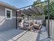 Outdoor patio with shaded seating area, perfect for relaxing and entertaining at 214 Wilcrest Dr, Matthews, NC 28105