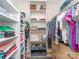 Organized walk-in closet with shelving units and clothes racks for ample storage space at 214 Wilcrest Dr, Matthews, NC 28105