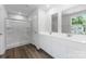 Bathroom with double sink vanity, glass shower, and a large mirror at 217 Basildon St # 1018, Lancaster, SC 29720