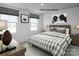 Comfortable bedroom with plaid bedding, decor, and windows with natural light at 217 Basildon St # 1018, Lancaster, SC 29720