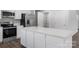Bright kitchen with white cabinets, stainless steel appliances, and a large center island at 217 Basildon St # 1018, Lancaster, SC 29720